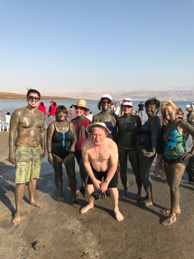 Soaking in the Dead Sea Mud with some of our travel group members! Great people.
